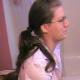 A studious-looking girl wearing glasses and with a New Jersey accent is recorded taking a wet-sounding shit while sitting on a toilet. She complains about the smell and then wipes her ass. The woman filming cuts a loud fart, too. Over 4 minutes.